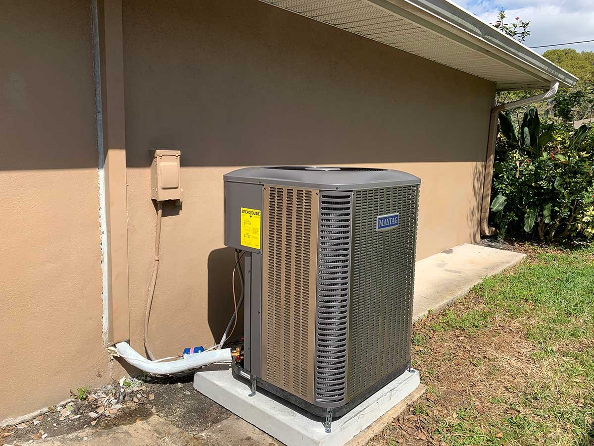 A1 A/C Service technicians evaluating cooling unit